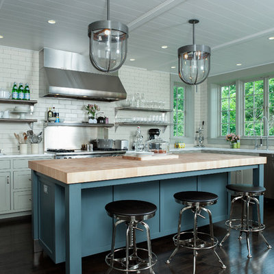 Example of a trendy kitchen design in New York with open cabinets, subway tile backsplash, wood countertops, white backsplash, gray cabinets and stainless steel appliances