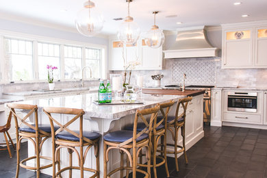 Eat-in kitchen - large cottage slate floor and black floor eat-in kitchen idea in New York with an island, an undermount sink, recessed-panel cabinets, white cabinets, quartz countertops, gray backsplash, marble backsplash and stainless steel appliances