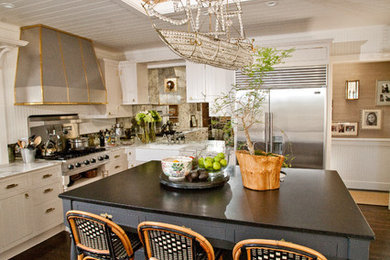Bohemian kitchen in San Diego with stainless steel appliances and a belfast sink.
