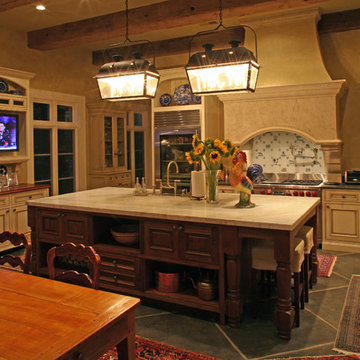 Antique beams highlight  and give warmth to this kitchen.