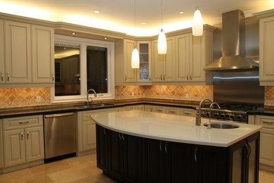 Large elegant u-shaped travertine floor kitchen photo in Toronto with an undermount sink, raised-panel cabinets, beige cabinets, quartz countertops, yellow backsplash, stainless steel appliances and an island