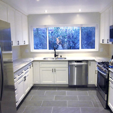 Aquarelle Counter with White Subway Tile Kitchen