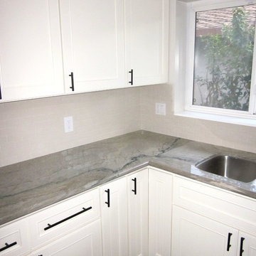 Aquarelle Counter with White Subway Tile Kitchen