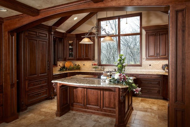 Inspiration for a large timeless u-shaped ceramic tile and beige floor open concept kitchen remodel in Kansas City with raised-panel cabinets, medium tone wood cabinets, granite countertops, beige backsplash, stone tile backsplash, an island, an undermount sink and paneled appliances