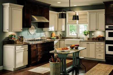 Inspiration for a mid-sized transitional l-shaped dark wood floor eat-in kitchen remodel in Other with a farmhouse sink, shaker cabinets, white cabinets, granite countertops, gray backsplash, subway tile backsplash and stainless steel appliances