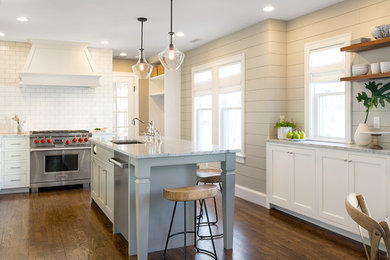 Eat-in kitchen - large transitional galley dark wood floor and brown floor eat-in kitchen idea in Boston with a farmhouse sink, shaker cabinets, white cabinets, soapstone countertops, white backsplash, ceramic backsplash, stainless steel appliances, an island and multicolored countertops