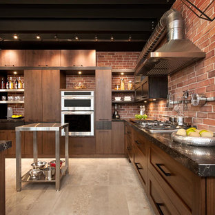Large industrial l-shaped kitchen in Montreal with a double-bowl sink, quartzite benchtops, stainless steel appliances, with island and matchstick tile splashback.