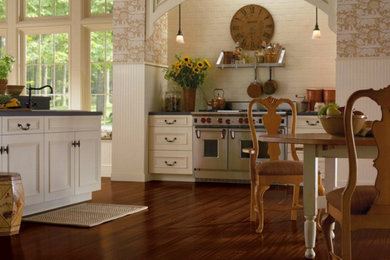 Example of a mid-sized trendy dark wood floor and brown floor kitchen design in Wichita