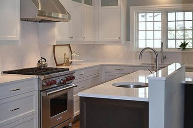 Inspiration for a classic l-shaped kitchen/diner in Ottawa with a submerged sink, shaker cabinets, white cabinets, engineered stone countertops, white splashback, stone slab splashback and stainless steel appliances.