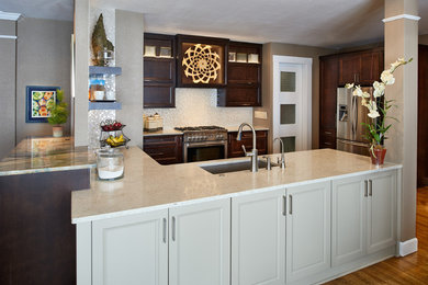 Open concept kitchen - mid-sized transitional u-shaped medium tone wood floor open concept kitchen idea in Denver with a single-bowl sink, flat-panel cabinets, dark wood cabinets, quartzite countertops, white backsplash, glass tile backsplash, stainless steel appliances and no island