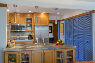 Kitchen pantry - small transitional galley kitchen pantry idea in San Francisco with an undermount sink, shaker cabinets, light wood cabinets, granite countertops, blue backsplash, porcelain backsplash, stainless steel appliances and a peninsula