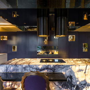 This is an example of an eclectic l-shaped kitchen in Brisbane with an undermount sink, flat-panel cabinets, purple cabinets, white splashback, mosaic tile splashback, black appliances and with island.