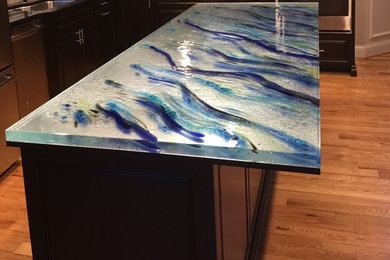 Trendy kitchen photo in Montreal with glass countertops