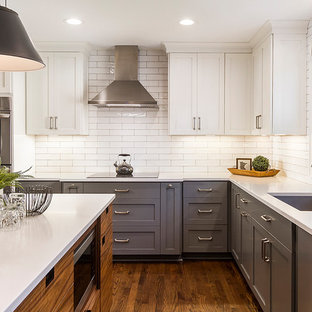 Mid-sized transitional eat-in kitchen designs - Inspiration for a mid-sized transitional l-shaped medium tone wood floor and brown floor eat-in kitchen remodel in Minneapolis with an undermount sink, shaker cabinets, gray cabinets, quartzite countertops, white backsplash, subway tile backsplash, stainless steel appliances, an island and white countertops