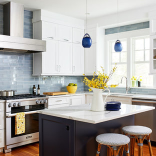 Inspiration for a mid-sized transitional u-shaped eat-in kitchen in DC Metro with an undermount sink, recessed-panel cabinets, white cabinets, quartz benchtops, brown splashback, glass tile splashback, stainless steel appliances, medium hardwood floors and with island.