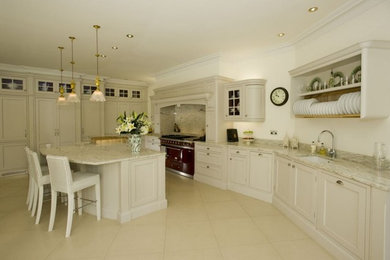 Photo of a large classic kitchen/diner in Hampshire with a single-bowl sink, shaker cabinets, granite worktops, coloured appliances and an island.