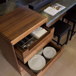 Eat-in kitchen - huge contemporary limestone floor eat-in kitchen idea in San Francisco with an undermount sink, flat-panel cabinets, light wood cabinets, granite countertops, multicolored backsplash, stainless steel appliances and two islands