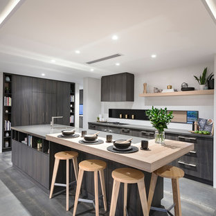 Asian l-shaped eat-in kitchen in Perth with an undermount sink, flat-panel cabinets, grey cabinets, stainless steel appliances, with island and grey floor.