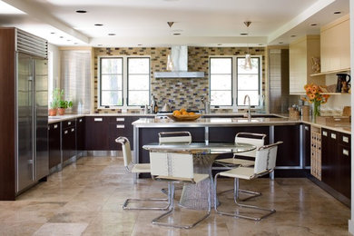 Photo of a contemporary kitchen in Houston with a breakfast bar.