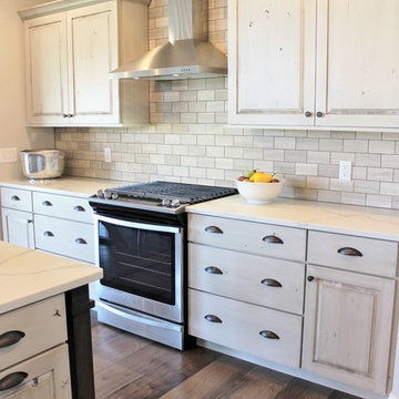 Aspen Homes- Antique White painted cabinets with Gray Stained Accents