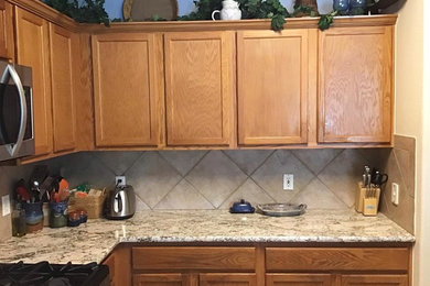 Kitchen photo in Austin with granite countertops