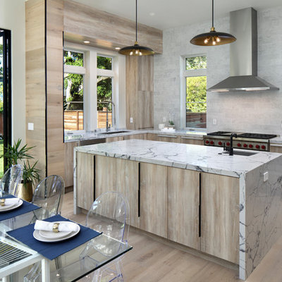 Eat-in kitchen - contemporary u-shaped light wood floor and beige floor eat-in kitchen idea in San Francisco with an undermount sink, flat-panel cabinets, light wood cabinets, gray backsplash, stainless steel appliances, an island and white countertops
