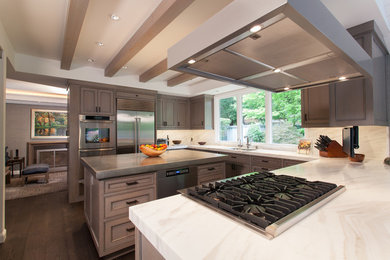 Example of a large transitional u-shaped dark wood floor eat-in kitchen design in San Francisco with an undermount sink, recessed-panel cabinets, gray cabinets, marble countertops, white backsplash, stone slab backsplash, stainless steel appliances and an island