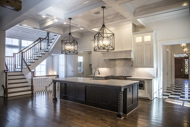 Inspiration for a large contemporary single-wall dark wood floor eat-in kitchen remodel in Atlanta with a farmhouse sink, shaker cabinets, white cabinets, soapstone countertops, white backsplash, subway tile backsplash, stainless steel appliances and an island