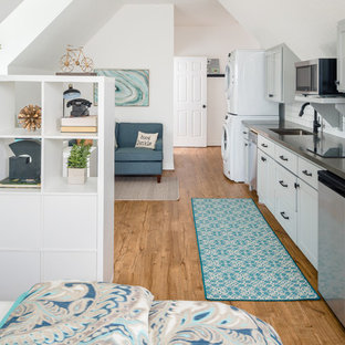 Small transitional open concept kitchen ideas - Small transitional single-wall vinyl floor open concept kitchen photo in Houston with an undermount sink, shaker cabinets, gray cabinets, quartz countertops, white backsplash, ceramic backsplash, stainless steel appliances and no island