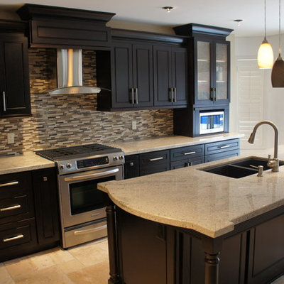 Eat-in kitchen - mid-sized contemporary l-shaped ceramic tile eat-in kitchen idea in Toronto with an undermount sink, raised-panel cabinets, dark wood cabinets, granite countertops, beige backsplash, glass sheet backsplash, stainless steel appliances and an island