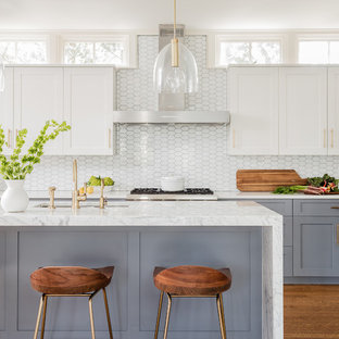 Mid-sized transitional galley separate kitchen in Boston with an undermount sink, recessed-panel cabinets, grey cabinets, marble benchtops, white splashback, glass tile splashback, stainless steel appliances, medium hardwood floors and with island.
