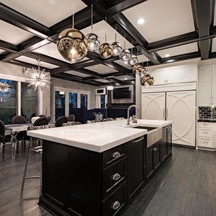 Photo of an expansive transitional l-shaped eat-in kitchen in Cleveland with a farmhouse sink, shaker cabinets, white cabinets, stainless steel appliances, with island, grey floor, quartzite benchtops, grey splashback, metal splashback, white benchtop and vinyl floors.