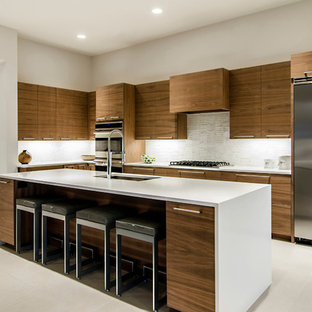 Modern kitchen designs - Minimalist kitchen photo in Dallas with matchstick tile backsplash and stainless steel appliances