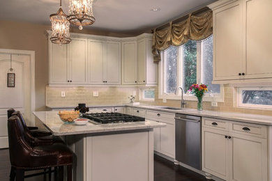 Example of a mid-sized transitional l-shaped open concept kitchen design in New York with an undermount sink, beaded inset cabinets, white cabinets, granite countertops, beige backsplash, glass tile backsplash, stainless steel appliances and an island
