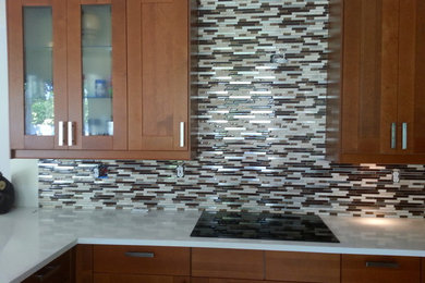 Example of a trendy kitchen design in Miami with multicolored backsplash and glass tile backsplash