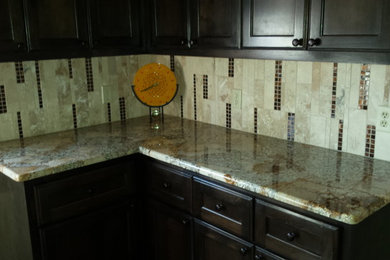 Kitchen - contemporary l-shaped kitchen idea in Austin with beige backsplash and stone tile backsplash