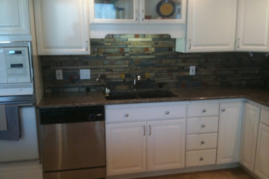 Example of a kitchen design in Other with glass tile backsplash
