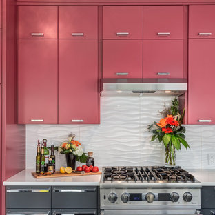 Mid-sized modern separate kitchen in Calgary with an undermount sink, flat-panel cabinets, red cabinets, quartz benchtops, white splashback, ceramic splashback, stainless steel appliances, porcelain floors and with island.