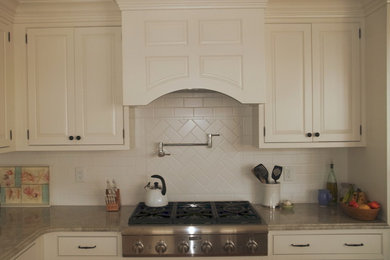 Kitchen - traditional kitchen idea in Philadelphia with beige backsplash and stone tile backsplash