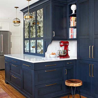 Kitchen - mid-sized transitional medium tone wood floor and brown floor kitchen idea in DC Metro with a single-bowl sink, blue cabinets, quartz countertops, white backsplash, subway tile backsplash, stainless steel appliances, a peninsula, white countertops and shaker cabinets