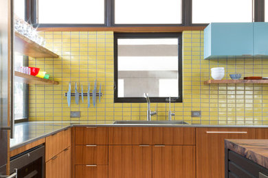 Example of a mid-sized mid-century modern kitchen design in Austin