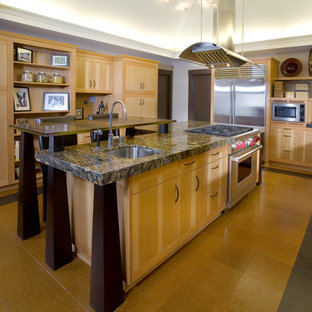 Asian kitchen appliance - Example of a zen kitchen design in Portland with stainless steel appliances, granite countertops, flat-panel cabinets, light wood cabinets, brown backsplash, mosaic tile backsplash and a single-bowl sink