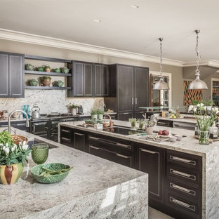Design ideas for a large classic single-wall kitchen in Surrey with a submerged sink, shaker cabinets, black cabinets, grey splashback, black appliances, multiple islands, grey floors, grey worktops and marble worktops.
