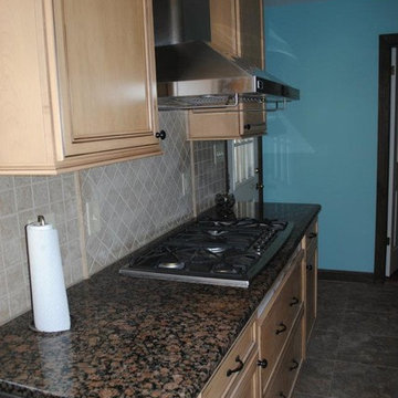 Baltic Brown Granite with Tile Backsplash, Maple Cabinets