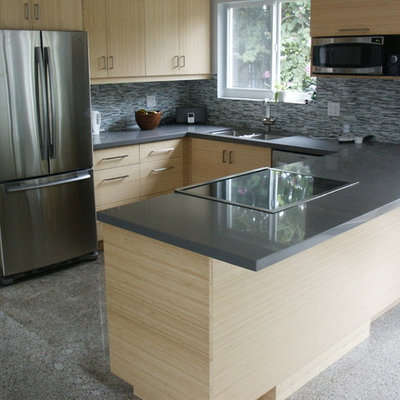 Eat-in kitchen - mid-sized contemporary u-shaped concrete floor eat-in kitchen idea in Miami with a double-bowl sink, flat-panel cabinets, light wood cabinets, quartz countertops, gray backsplash, matchstick tile backsplash, stainless steel appliances and a peninsula