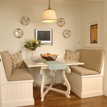 White kitchen dining with bench padded seats