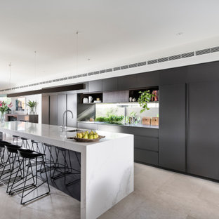 Photo of a large contemporary galley kitchen in Perth with an undermount sink, flat-panel cabinets, grey cabinets, window splashback, panelled appliances, with island, grey floor and grey benchtop.