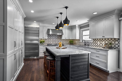 Enclosed kitchen - mid-sized traditional u-shaped enclosed kitchen idea in Chicago with recessed-panel cabinets, gray cabinets, marble countertops and an island