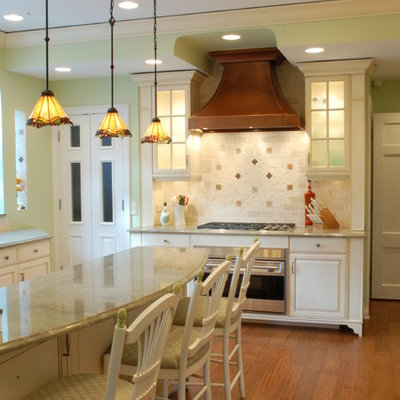 Example of a classic kitchen design in Chicago with raised-panel cabinets, white cabinets, multicolored backsplash and stainless steel appliances