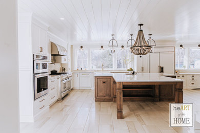 Example of a huge cottage u-shaped porcelain tile and gray floor eat-in kitchen design in Chicago with a farmhouse sink, shaker cabinets, white cabinets, quartz countertops, gray backsplash, porcelain backsplash, stainless steel appliances, an island and white countertops